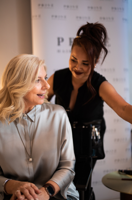 woman beside her mobile hair and makeup artist