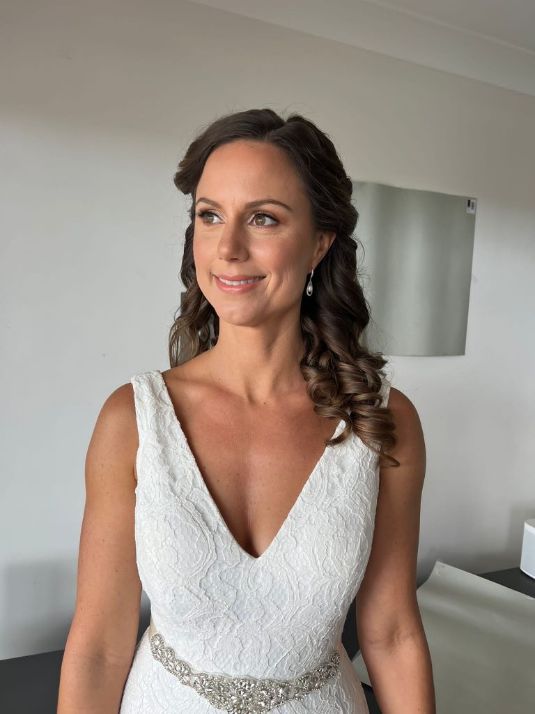 beautiful bride with her hair and makeup done at her wedding