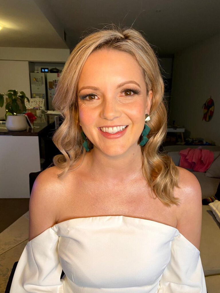 smiling bride satisfied with her hair and make up done by Privé